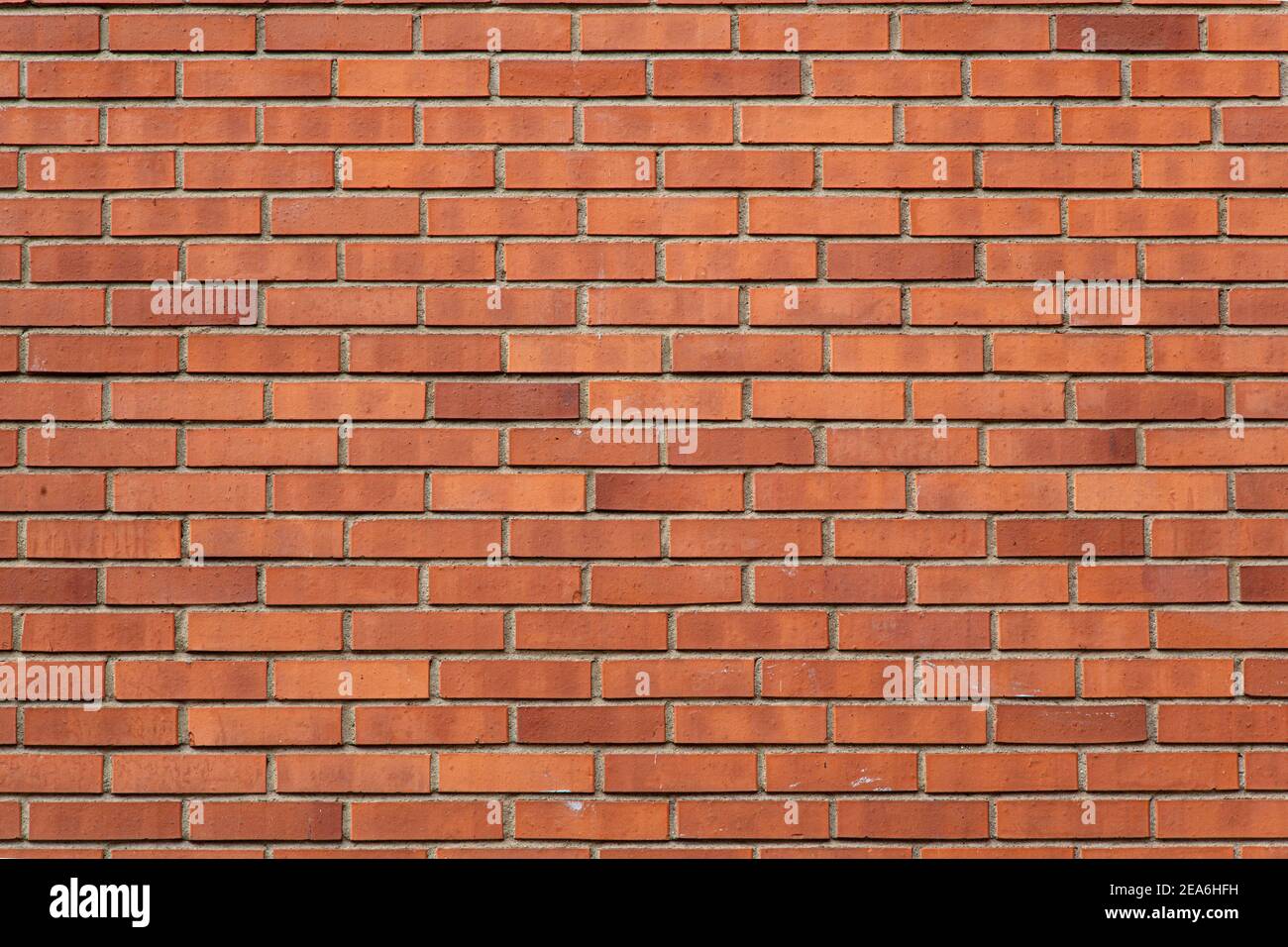 Muro di mattoni sfondo. Motivo di sovrapposizione in mattoni rossi Foto Stock