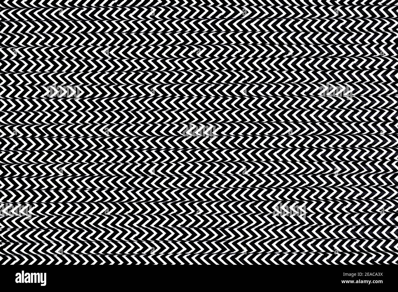 Cannucce in carta bianca con linee a zigzag nere Foto Stock