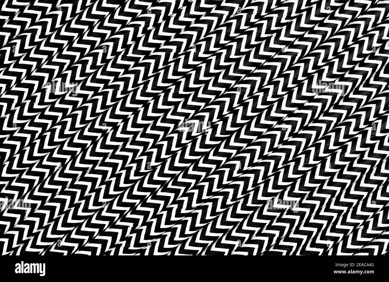 Cannucce in carta bianca con linee a zigzag nere Foto Stock