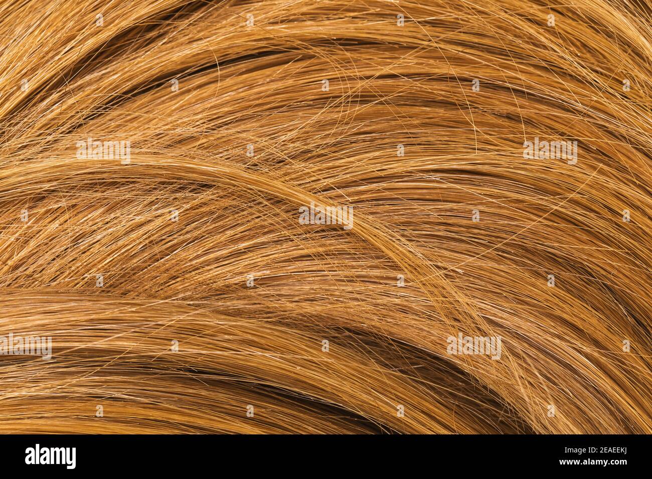 Sfondo di capelli femminili di colore marrone chiaro. Foto Stock