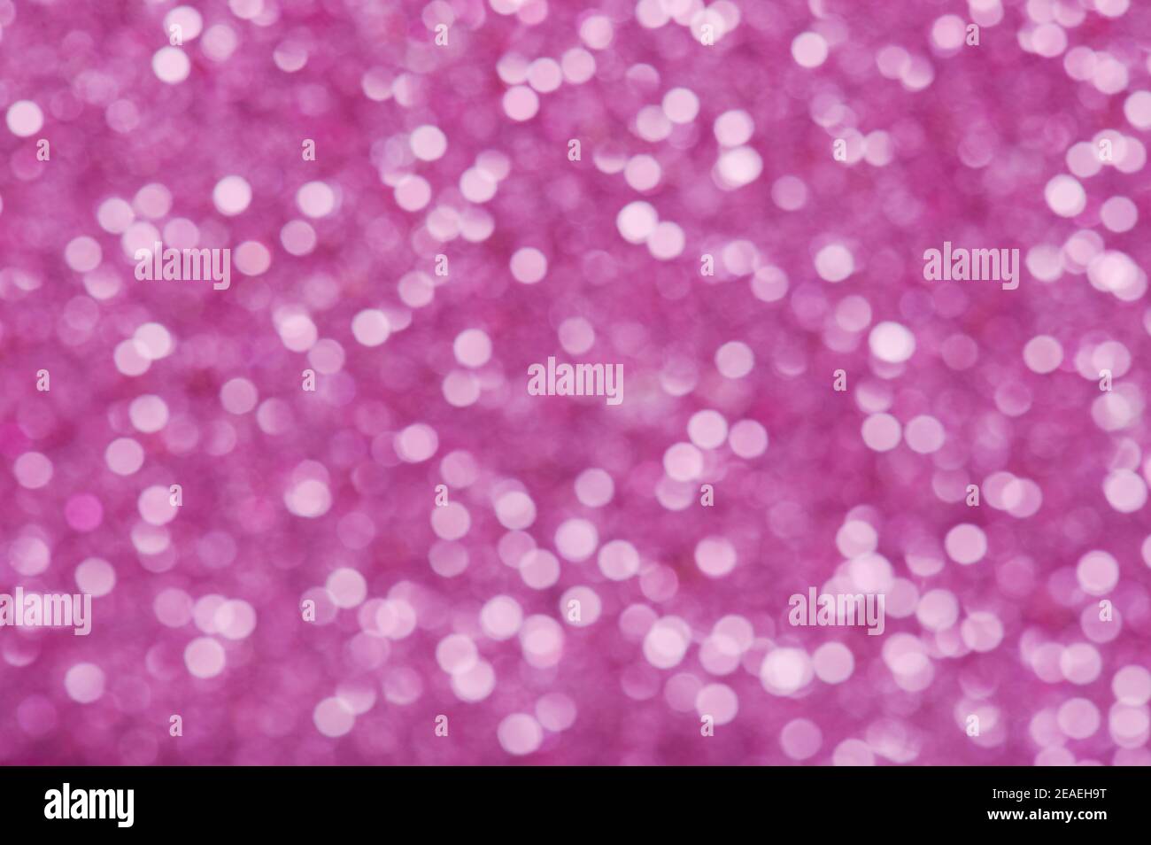 Sfondo glitter rosa sfocato. Cerchio chiaro viola Foto stock - Alamy