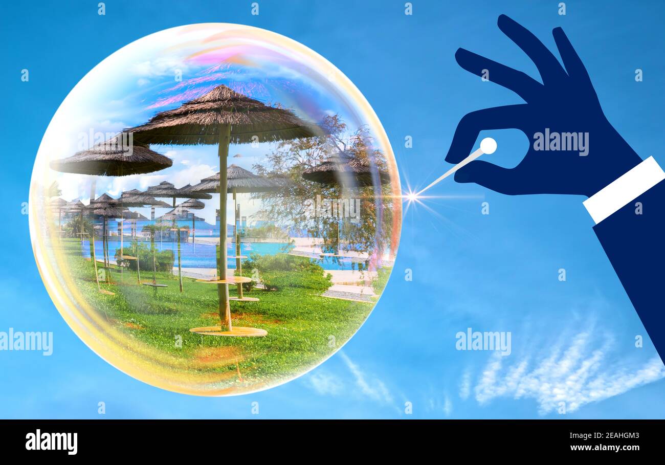 Mano con un ago sollevato fino a formare una bolla di sapone. Bolla con foto vacanza che sta per esplodere da un ago. La vacanza può scoppiare come una bolla di sapone Foto Stock