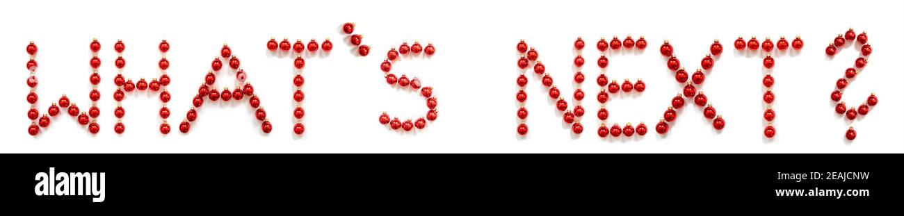Red Christmas Ball Ornament Building Word What is Next Foto Stock