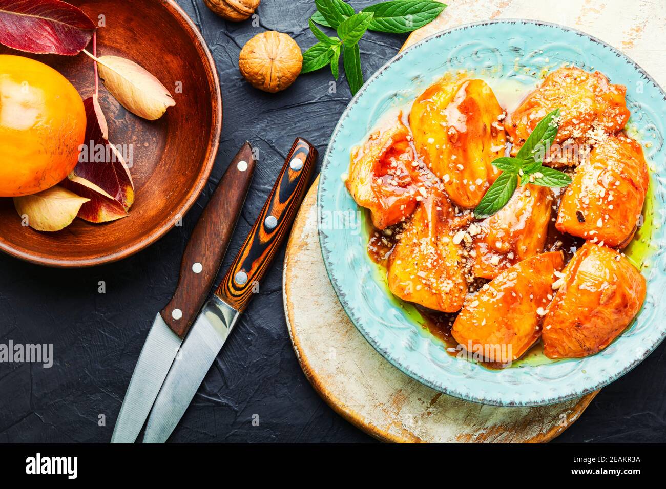 Pezzi di persimmon caramellato. Foto Stock