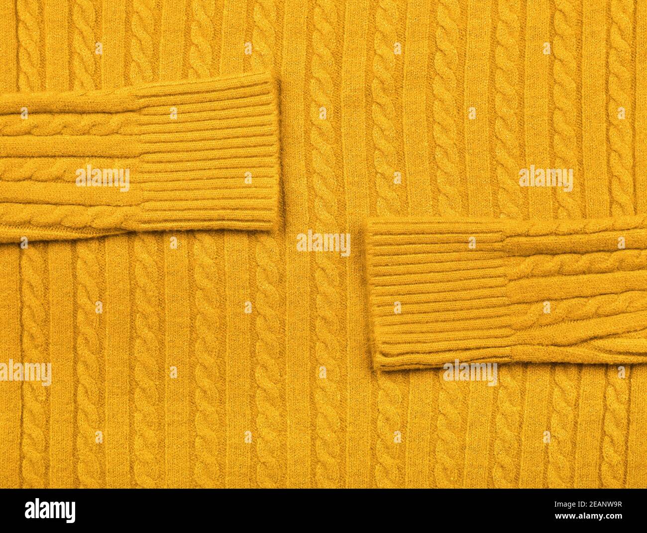 Trama di fondo di tessuto giallo di lana lavorato a maglia Foto Stock