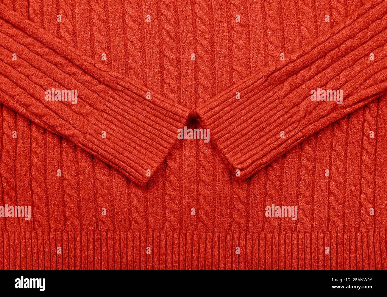 Trama di fondo di tessuto di lana lavorato a maglia rosso Foto Stock