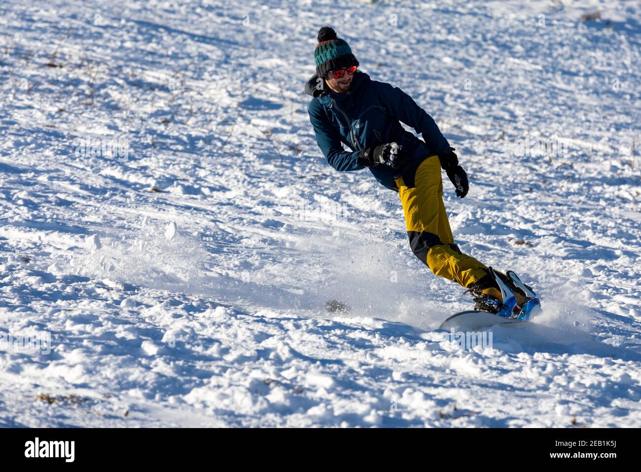 Un snowboarder sulla Arthur's Seat Foto Stock