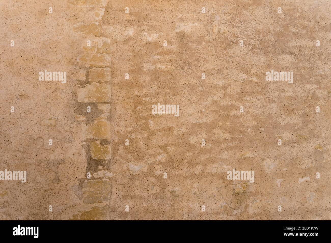 Sfondo dell'antica pietra arenaria mattoni e pietra muro in Francia Foto Stock