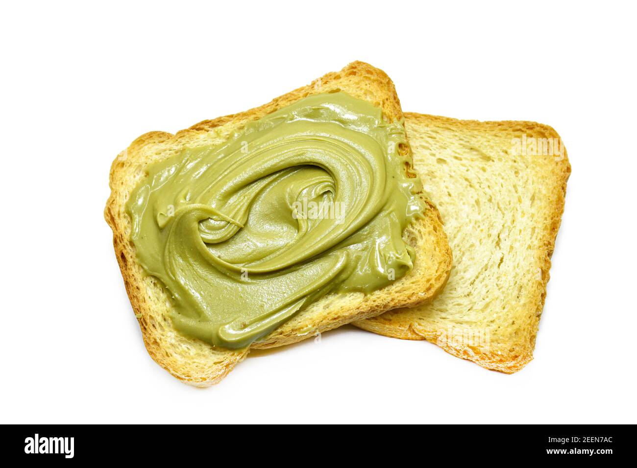 toast con crema di pistacchio adagiata su toast semplici isolati su bianco. Foto Stock