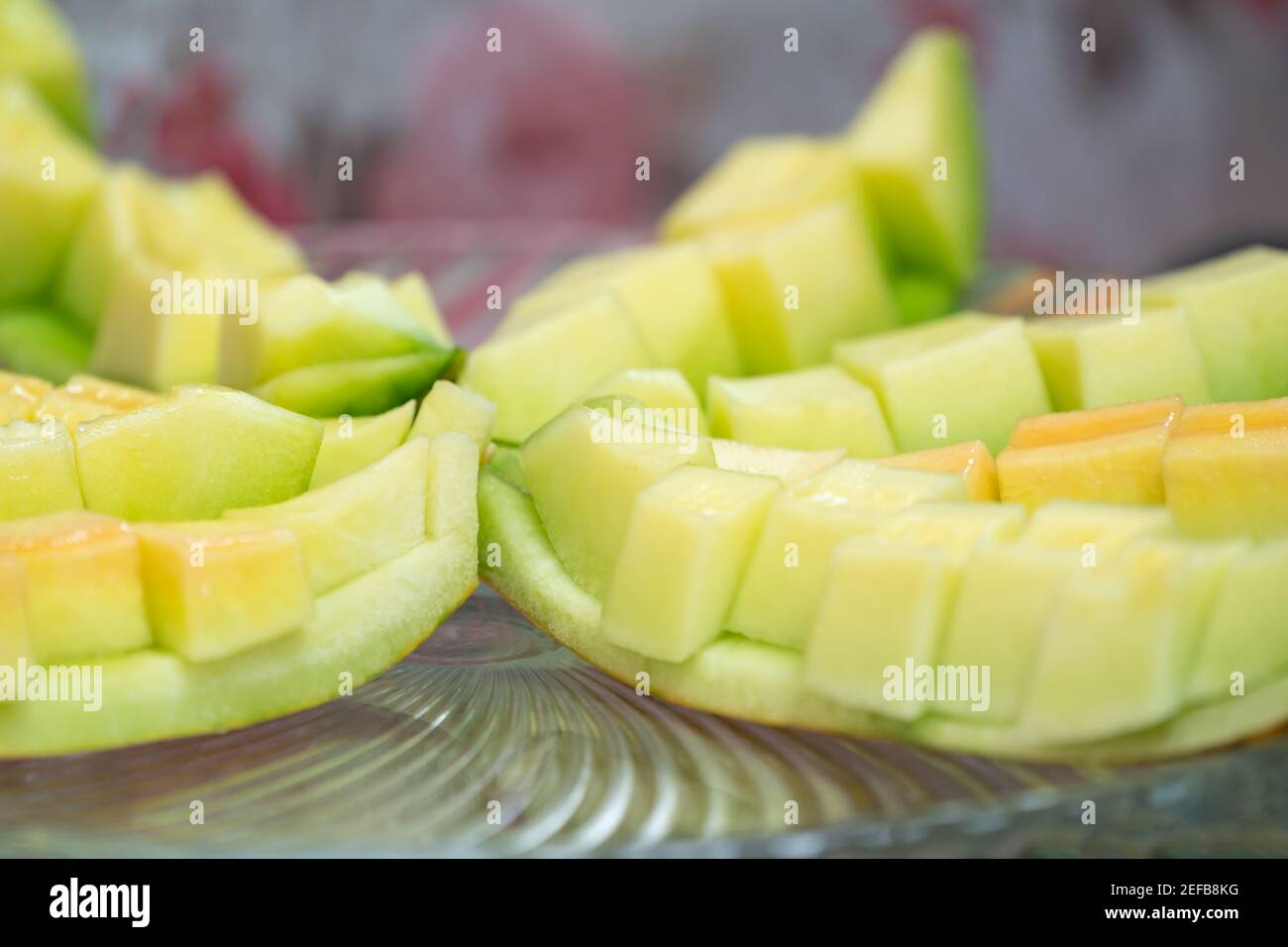 Vicino al Green Cantaloupe è stato fatto scorrere su capsula di vetro Foto Stock