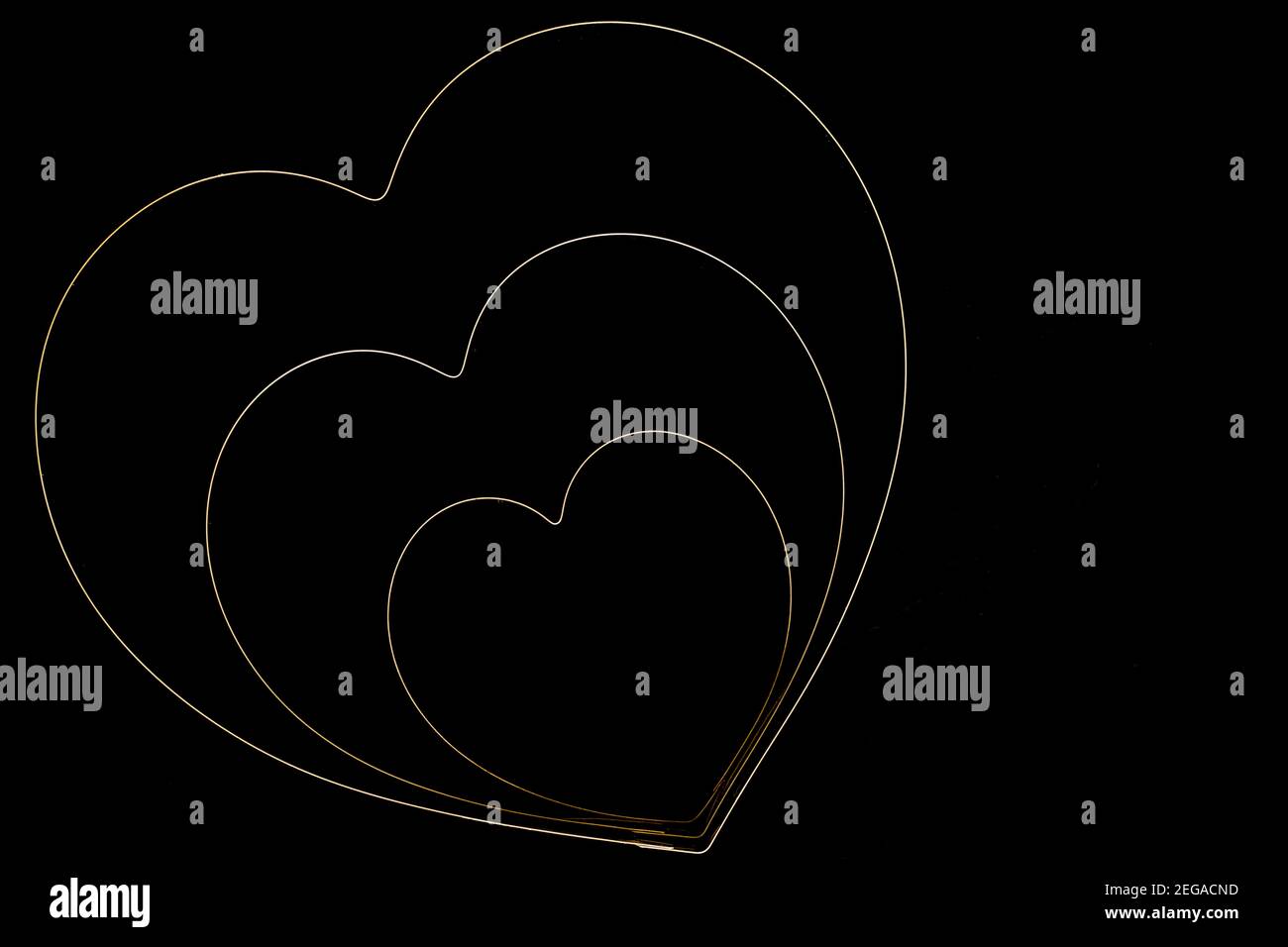 Cuori su sfondo nero Foto Stock