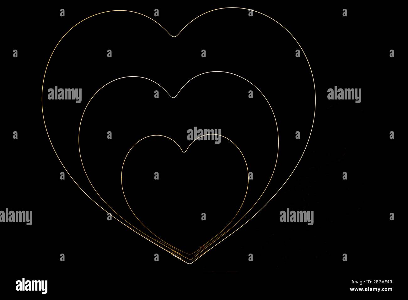 Cuori su sfondo nero Foto Stock