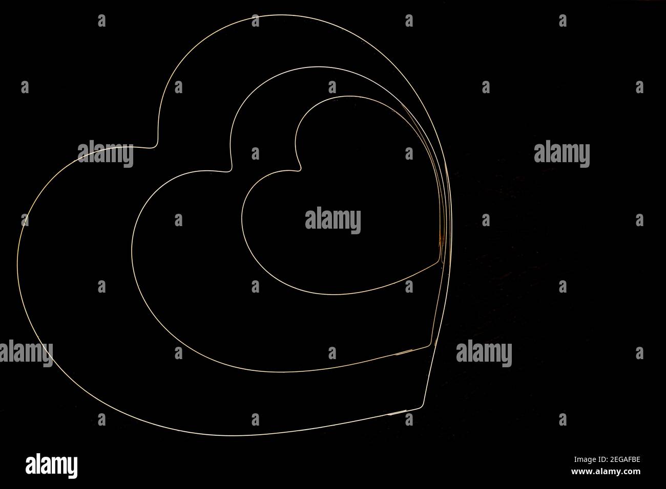Cuori su sfondo nero Foto Stock