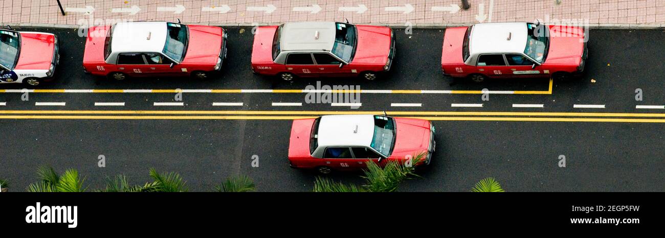 Taxi Red Toyota Comfort a Hong Kong. Foto Stock