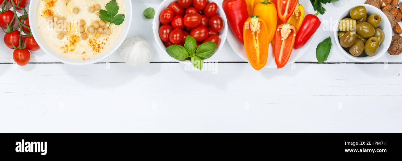 Vegetali sfondo sano vegan pulito mangiare cibo organico copyspace copia spazio su un banner in legno Foto Stock