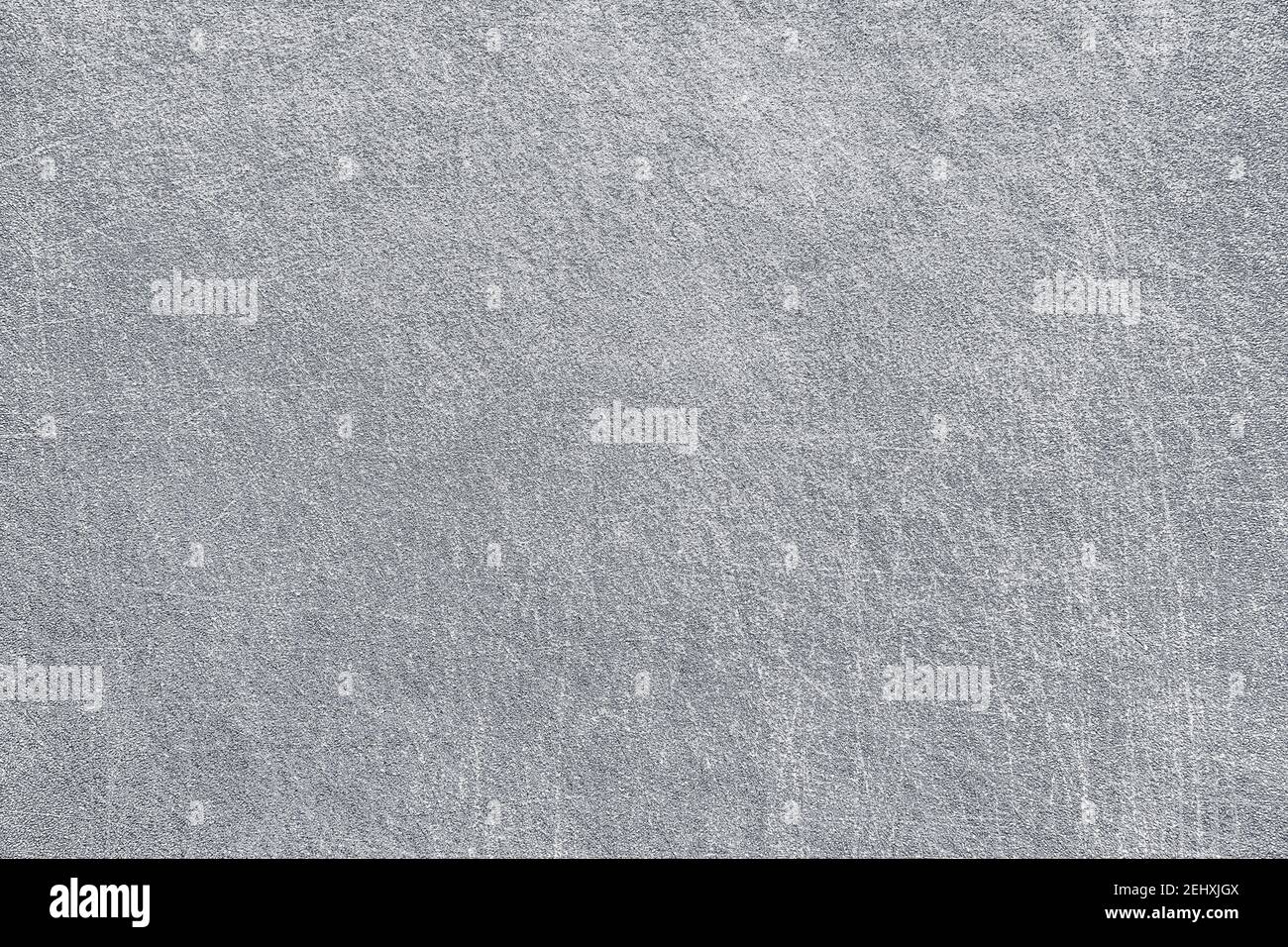Fondo in cemento grigio urbano ruvido con graffi. Vecchia superficie in metallo grigio fessurato rustica. Grunge cemento o argento materiale sfondo. Foto Stock