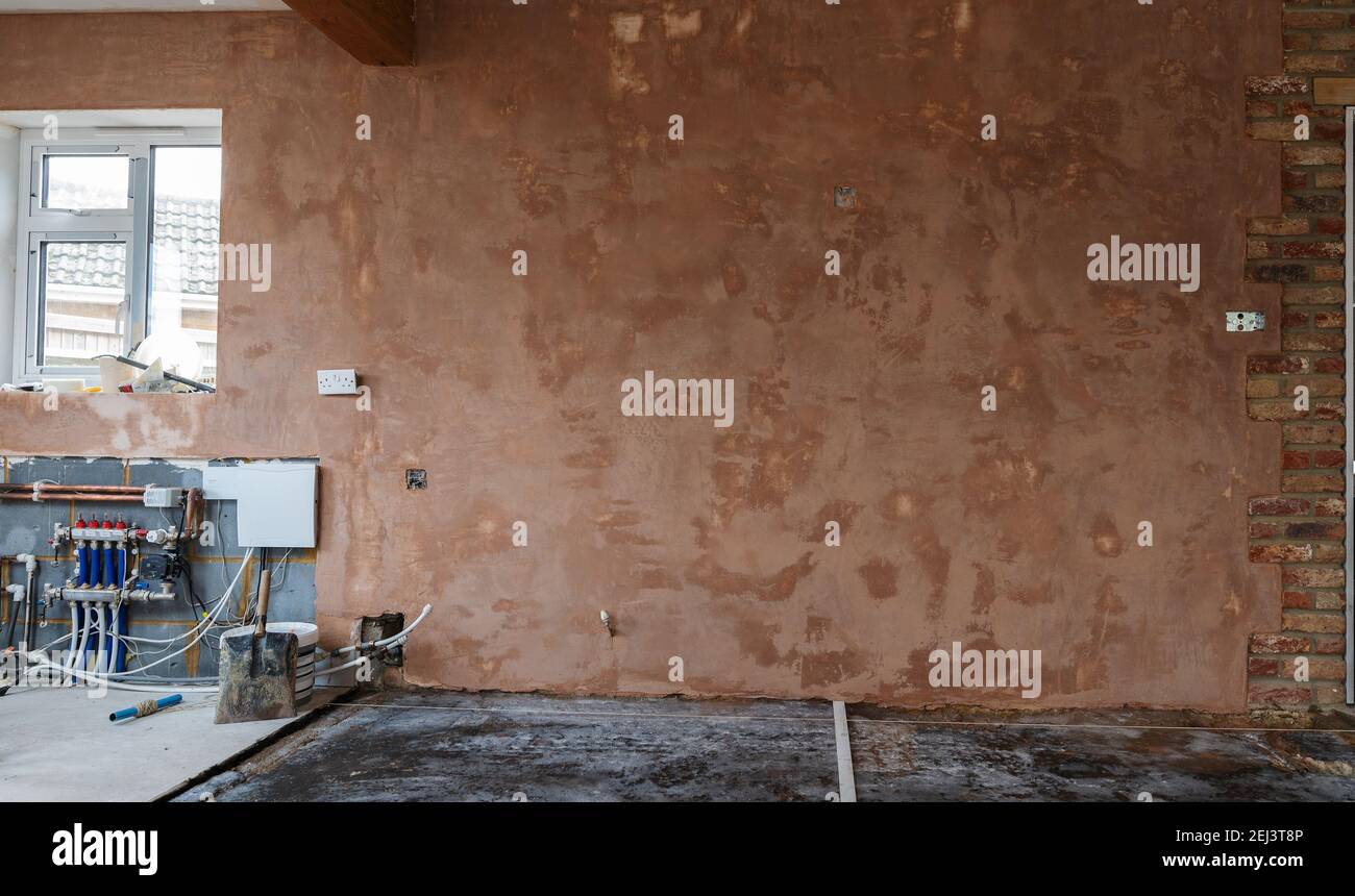 Intonacatura delle pareti, fondo marrone liscio Foto Stock