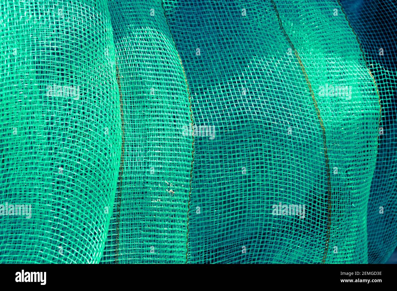 Mesh verde. Sfondo tessile verde. Foto Stock