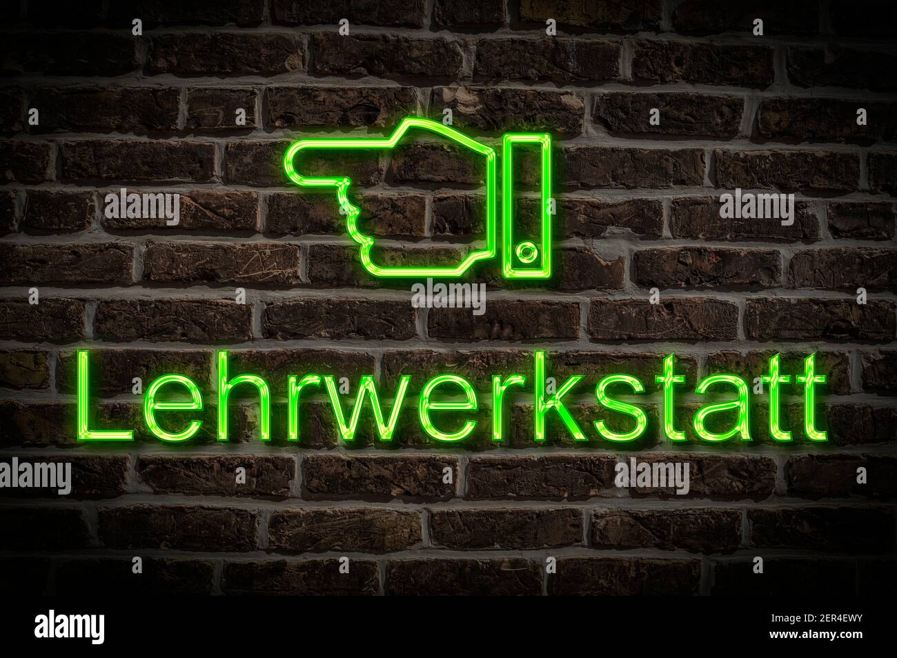 Foto di dettaglio di un cartello al neon su una parete con L'iscrizione Lehrwerkstatt (laboratorio di formazione) Foto Stock