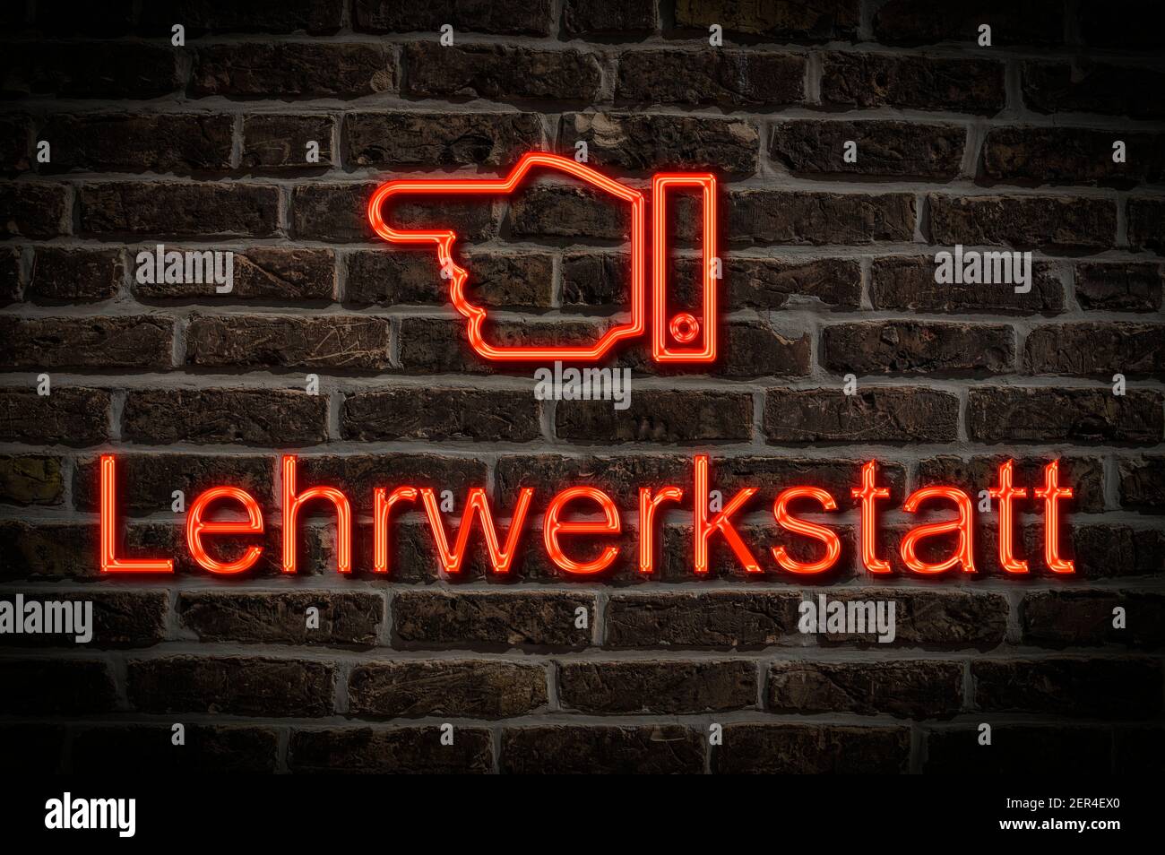Foto di dettaglio di un cartello al neon su una parete con L'iscrizione Lehrwerkstatt (laboratorio di formazione) Foto Stock