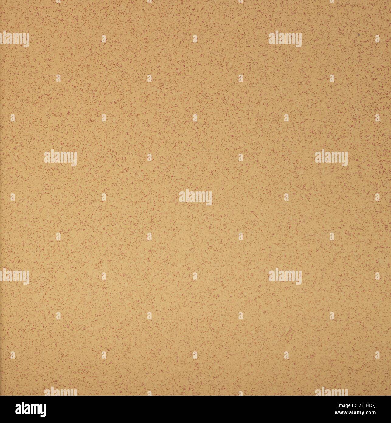 Sfondo piastrelle beige con puntini rossi all'interno Foto Stock