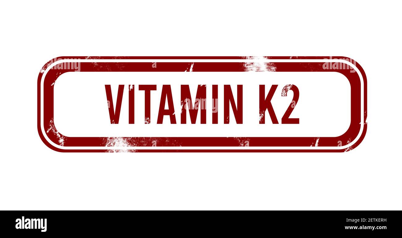 La vitamina K2 - rosso pulsante grunge, timbro Foto Stock