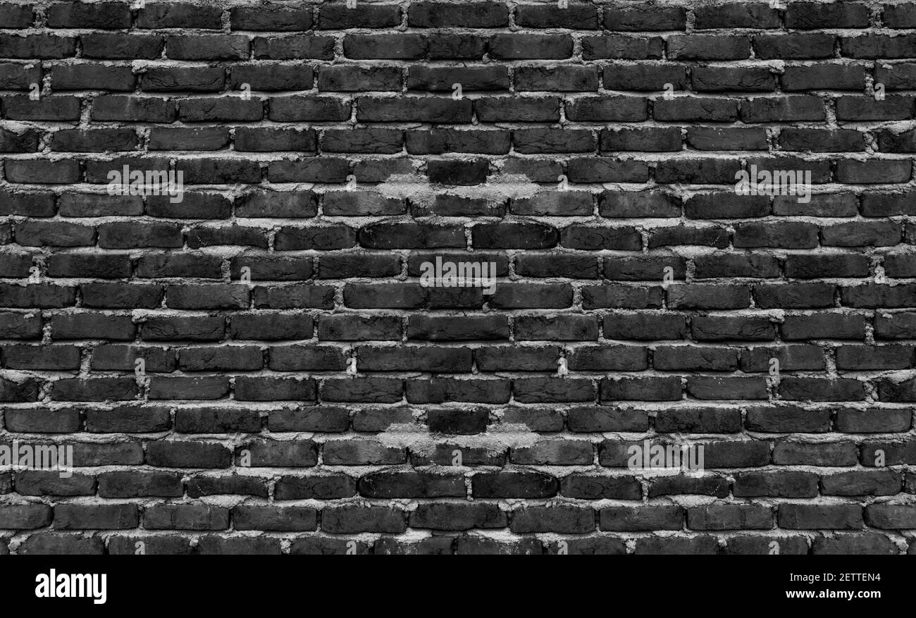 Vecchio muro di mattoni con crepe e graffi. Orizzontale ampio sfondo brickwall. Muro in difficoltà con struttura di mattoni rotti. Facciata casa d'epoca. Foto Stock