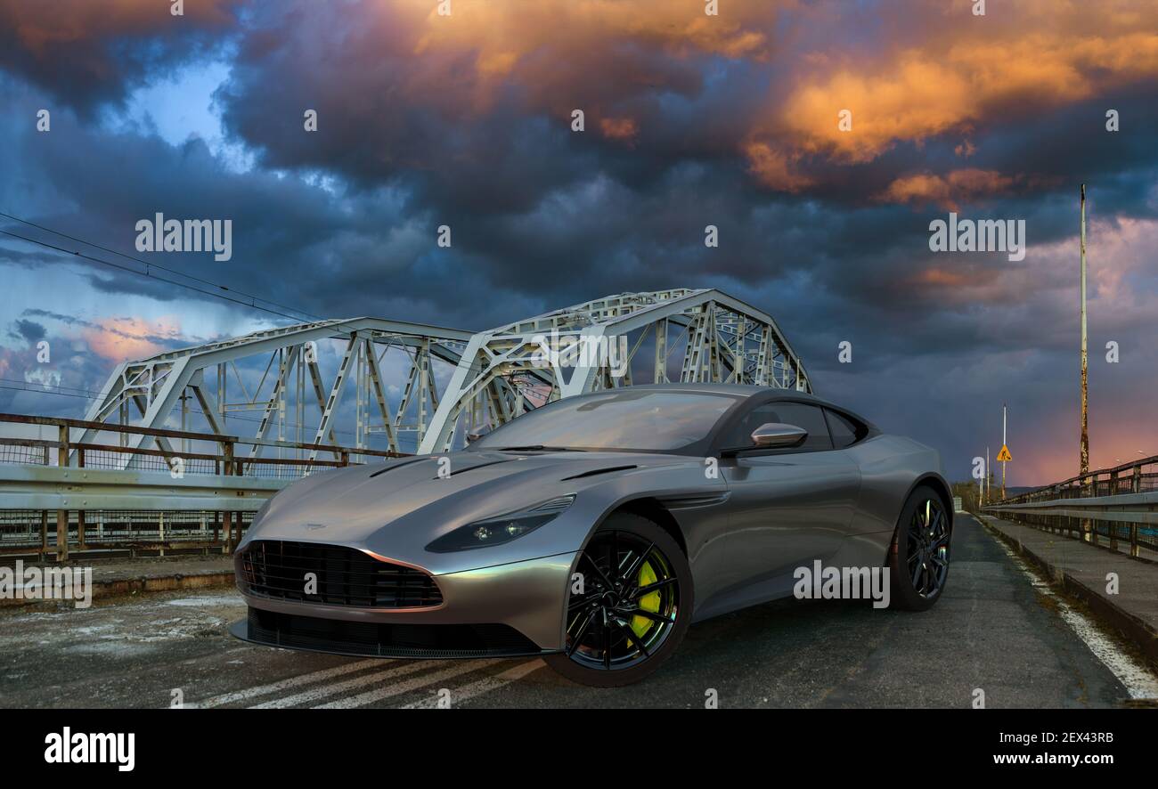 Aston Martin DB 11 in piedi sul ponte in retrò stile durante una tempesta serale Foto Stock