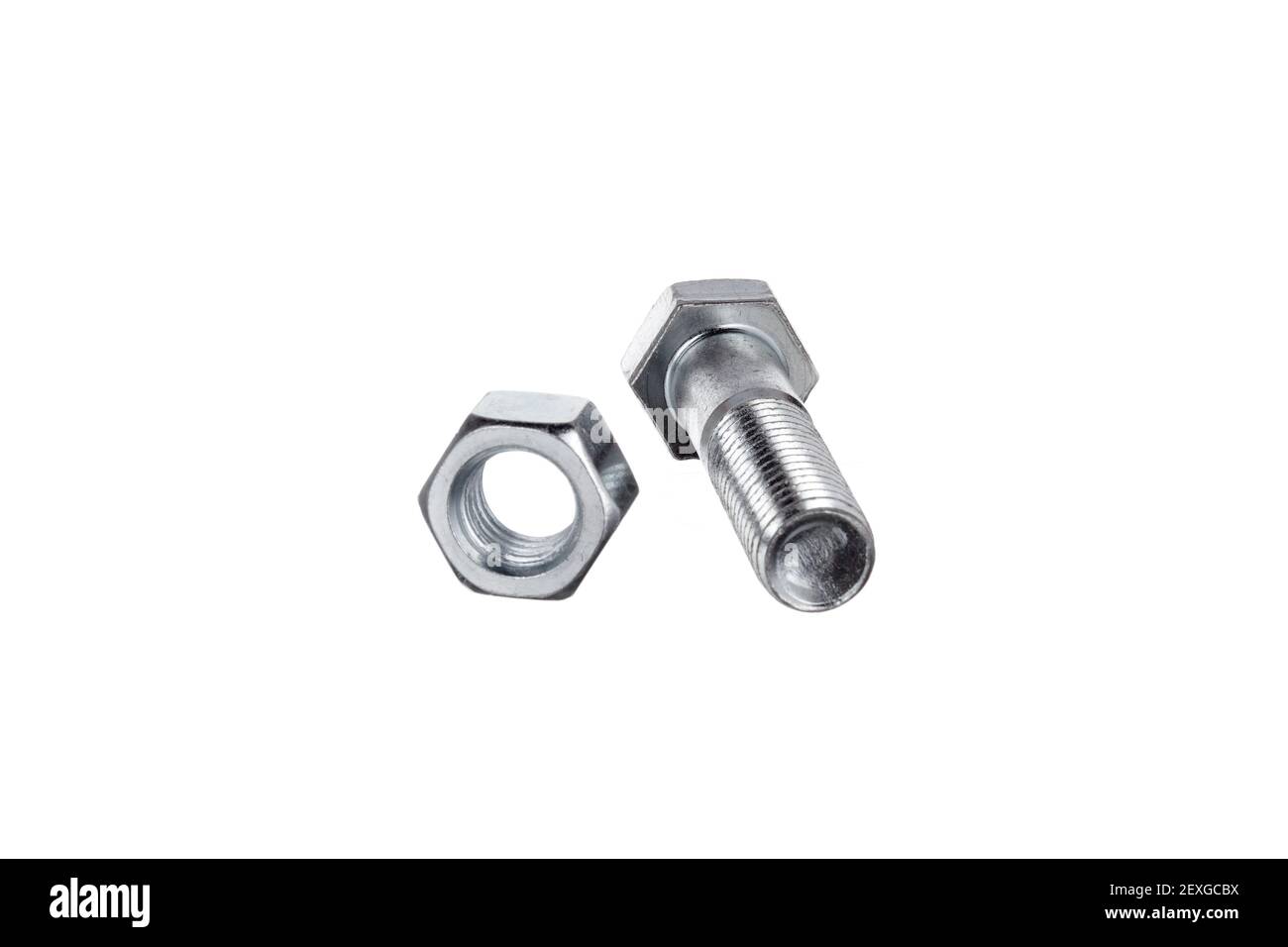 Bullone che giace accanto al dado Foto Stock