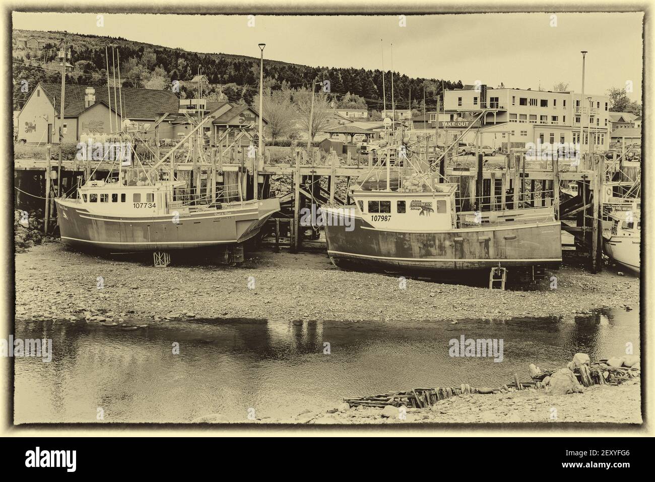 Barche di aragosta a bassa marea ad Alma, New Brunswick. Foto Stock