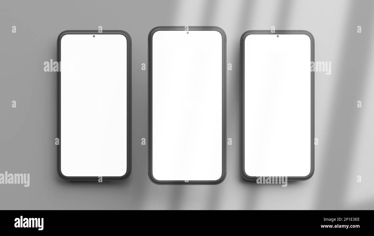 Tre modelli di telefoni verticali isolati su uno sfondo grigio in modalità flat lay e rendering 3D. Modello realistico di telaio cellulare e display vuoto conce Foto Stock