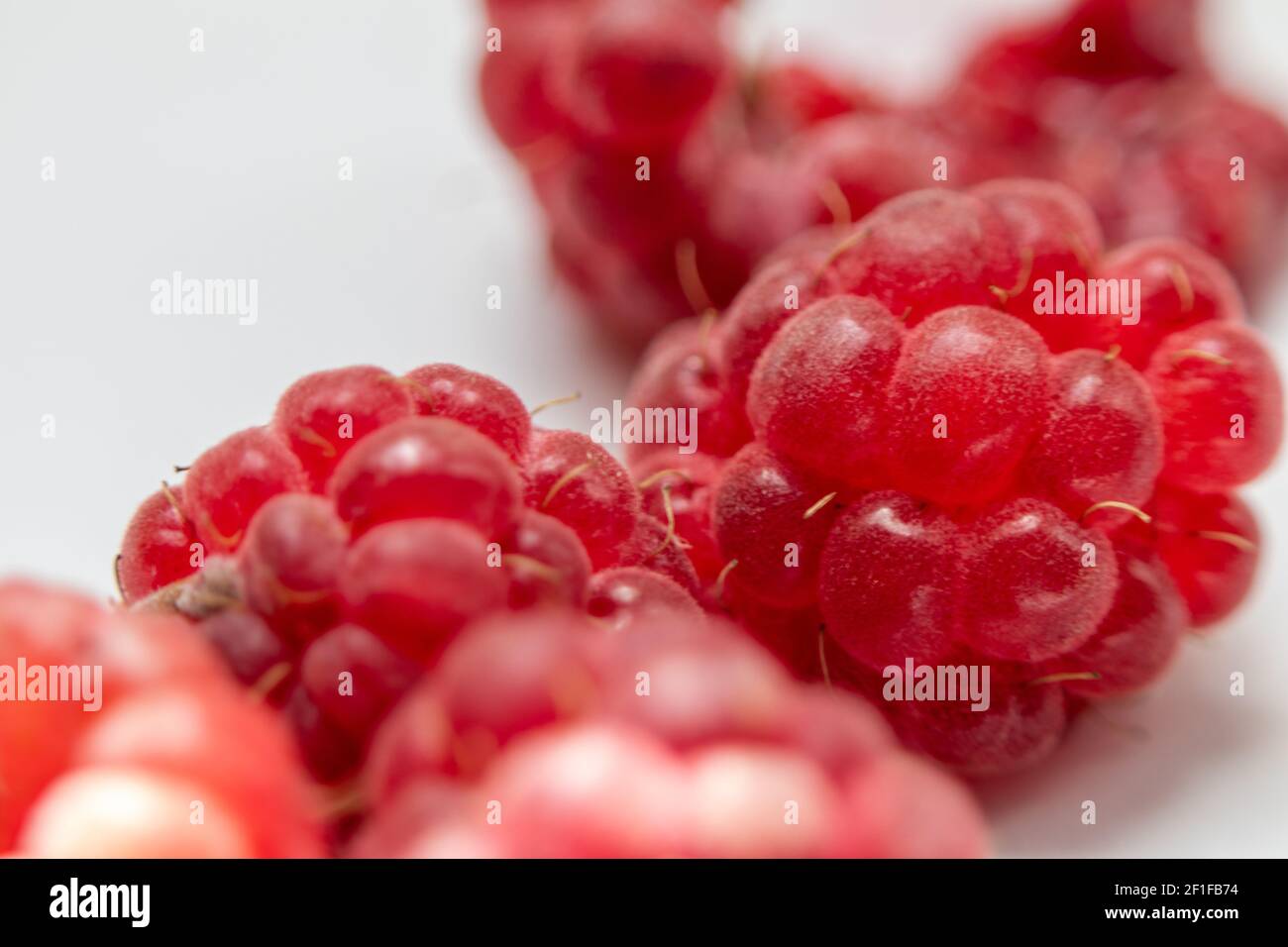 Primo piano. Primo piano di bacche di lamponi freschi e dolci rossi. . Foto macro. Foto Stock