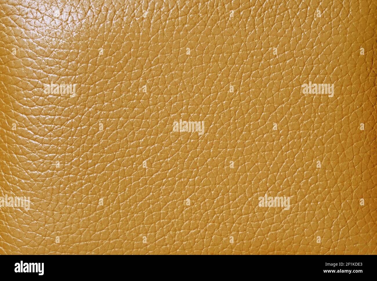 Texture di pelle di mucca colorata senape per sfondo astratto Foto Stock