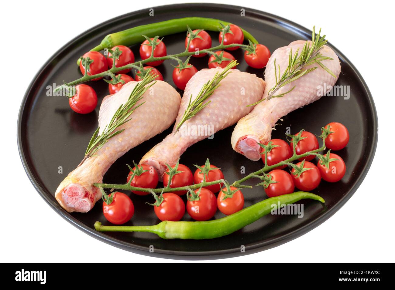 Bastone di pollo grezzo isolato su sfondo bianco Foto Stock