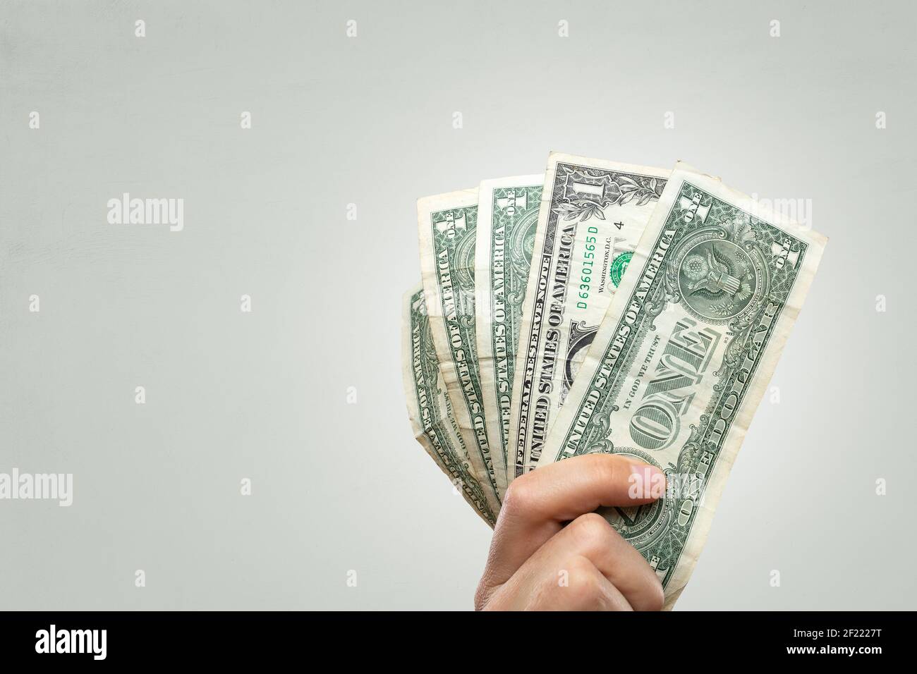 Dollaro USA tenuto da una mano Foto Stock