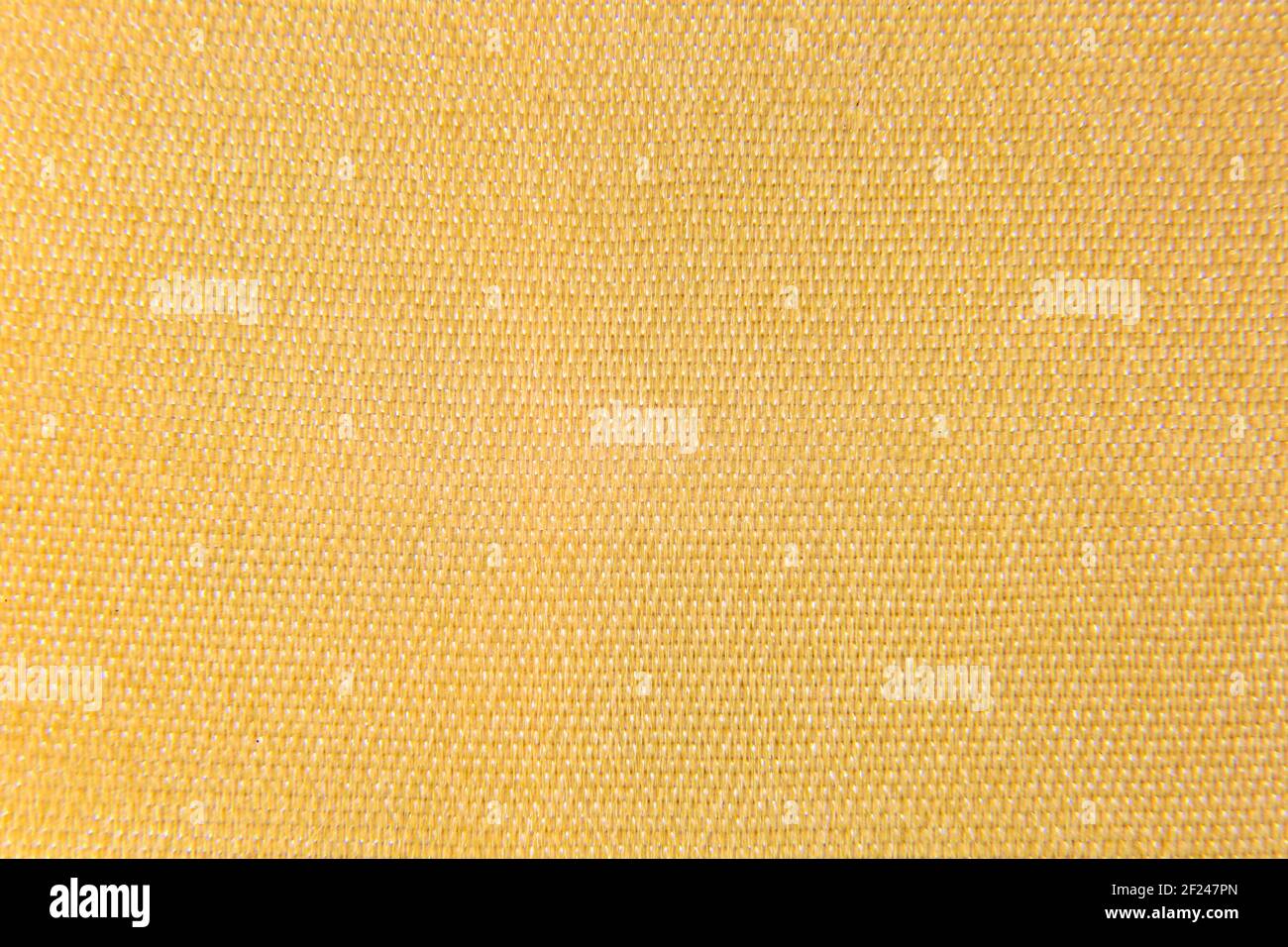 una foto sfondo giallo oro tessuto Foto Stock