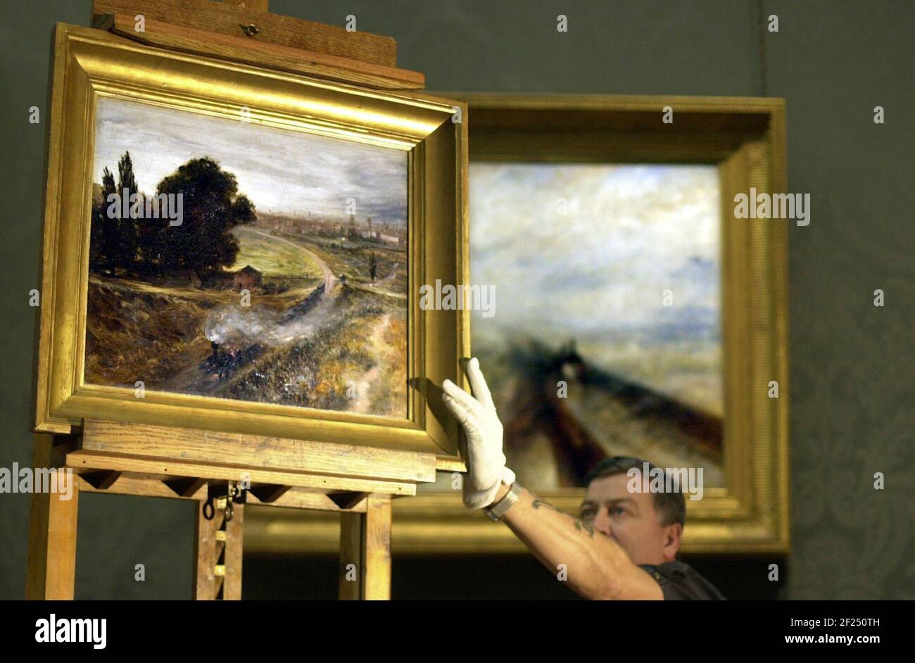 IL FAMOSO DIPINTO DI TURNER 'PIOGGIA, VAPORE E VELOCITÀ' (SFONDO) SARÀ VISTO FIANCO A FIANCO CON LA 'FERROVIA BERLINO-POSTDAM' DI MENZEL PER LA PRIMA VOLTA. SI PENSA CHE LA PITTURA DI SPERO ABBIA INFLUENZATO LA PITTURA DI MENZEL CHE SI PENSA SIA STATA PRODOTTA 4 ANNI DOPO. I DUE SARANNO IN MOSTRA FIANCO A FIANCO PER UNA SOLA SETTIMANA.23-2-2001 FOTO ANDY PARADISE Foto Stock