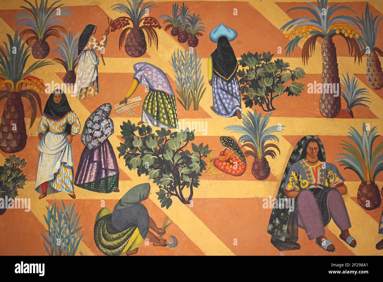 Arte beduina marocchina che mostra le donne che coltivano le palme della data Foto Stock
