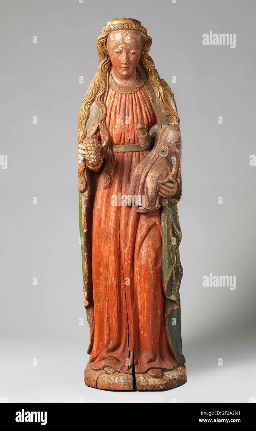 Maria Met Kind.She si alza leggermente in avanti con la gamba sinistra curva e indossa i tre quarti di sinistra sulla mano sinistra che tengono un mazzo di uve con il giudice. Il bambino, vestito con una camicia, ha sollevato la mano destra in modo blessingly. Della testa di Maria, alcuni risana di capelli dipendono; dai suoi capelli una corona di foglie e rosette. Il tappeto con archetto rotondo coperto da una cintura cade in pieghe a terra, rilasciando gli oggetti delle sue scarpe. Una giacca aperta pende dalle spalle. Foto Stock