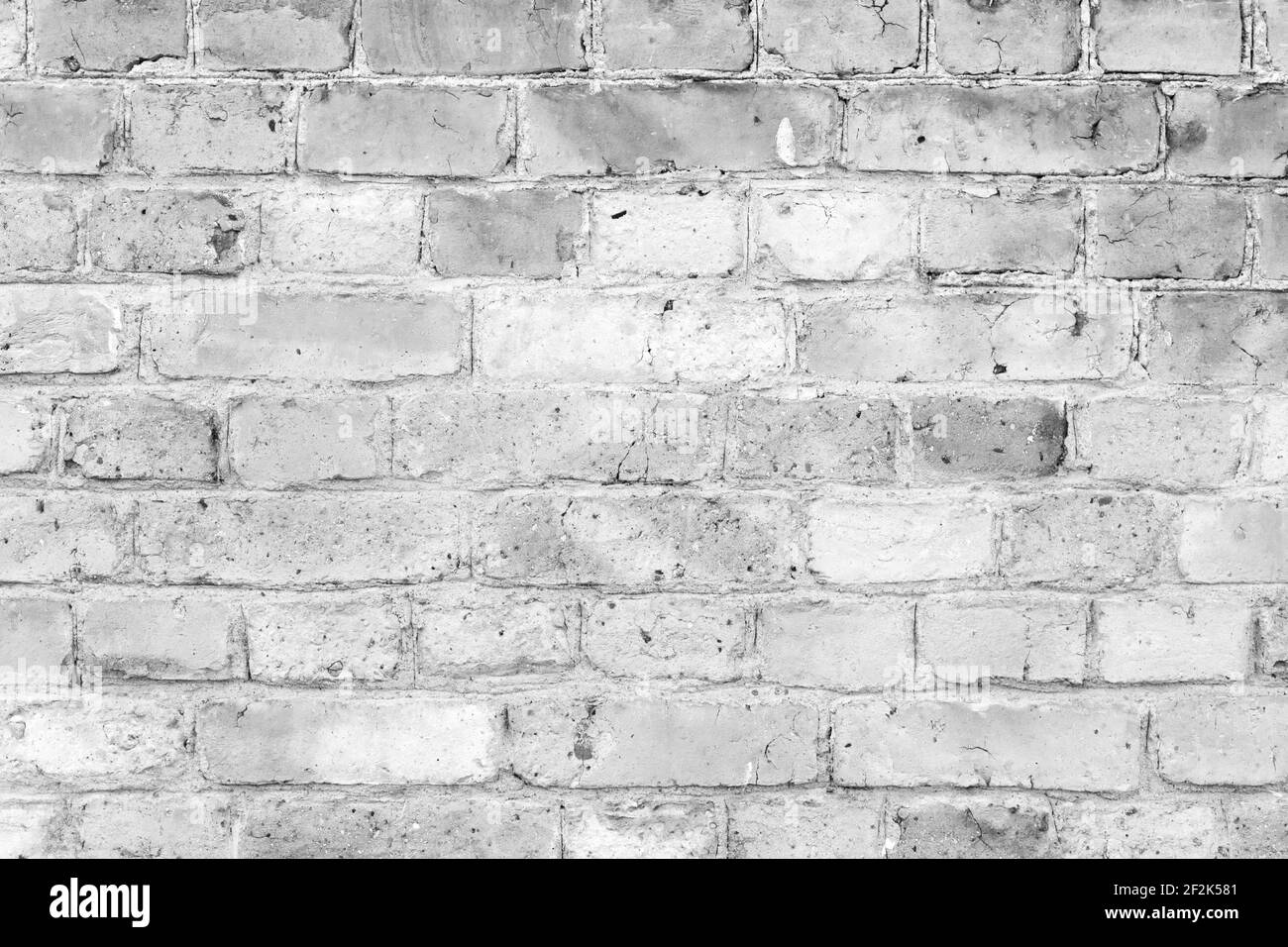 Vecchio muro di mattoni bianchi grugnosi, primo piano sfondo foto texture Foto Stock