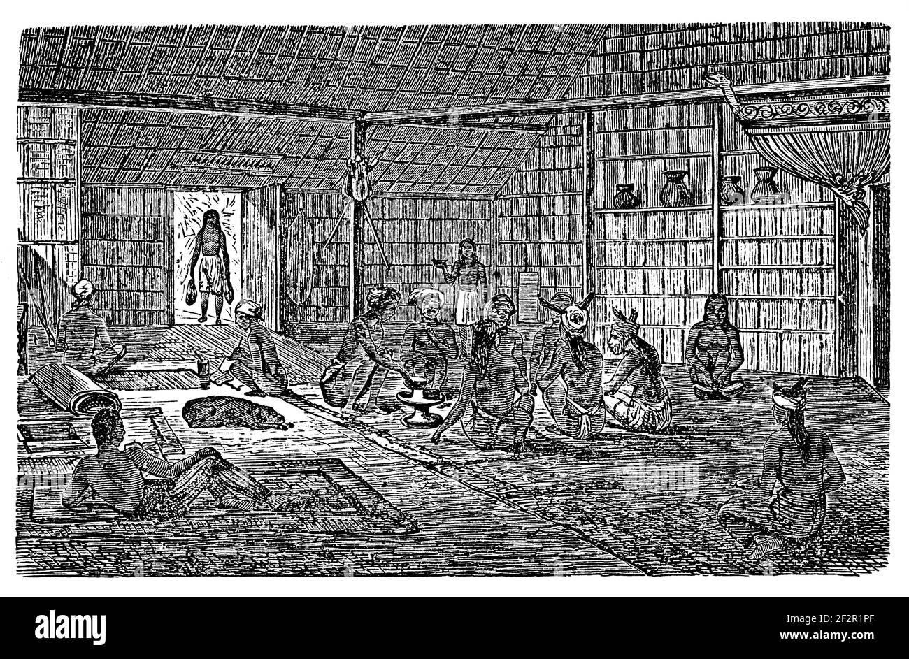 Incisione antica della vista interna della casa di Dayak. Illustrazione pubblicata in Systematischer Bilder-Atlas zum Conversations-Lexikon, Ikonographische ency Foto Stock