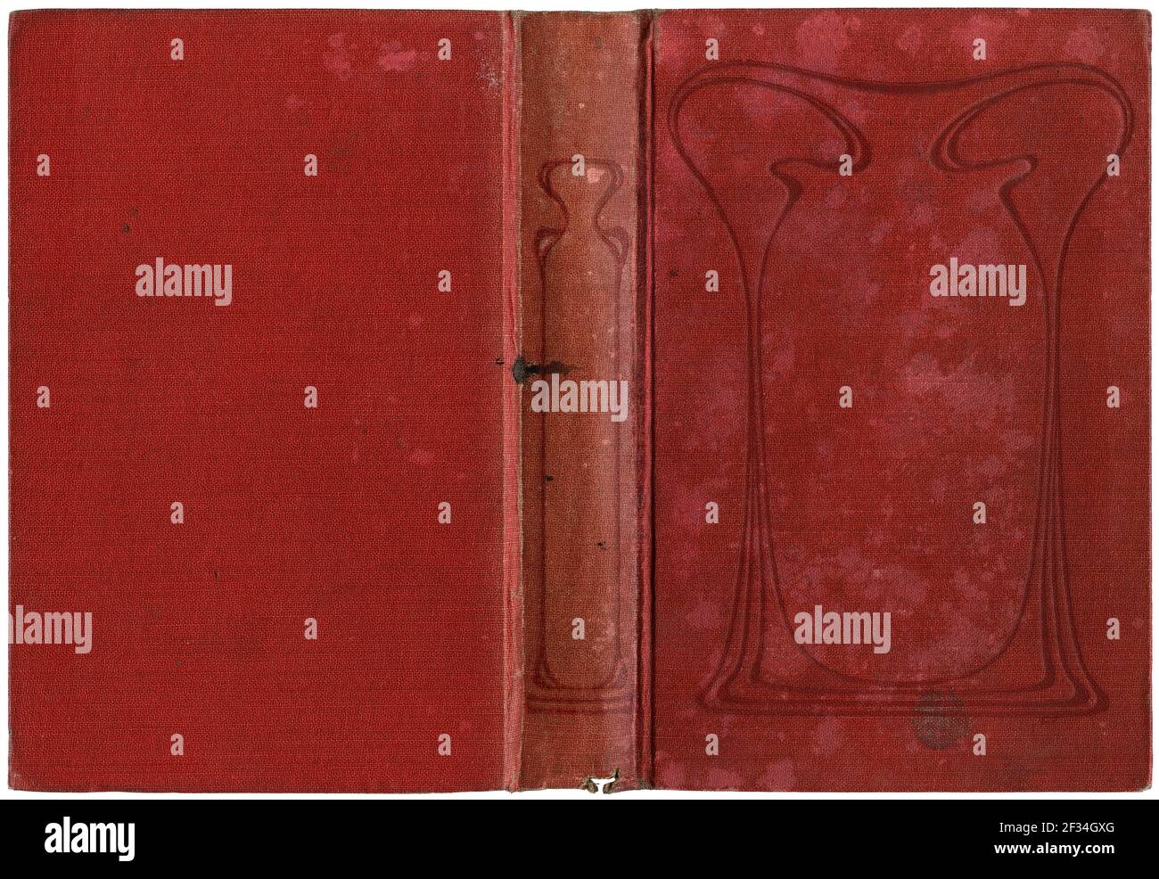 Copertina di un vecchio libro aperto, tela rossa indossata - circa 1909 - con ornamenti in stile art nouveau Foto Stock