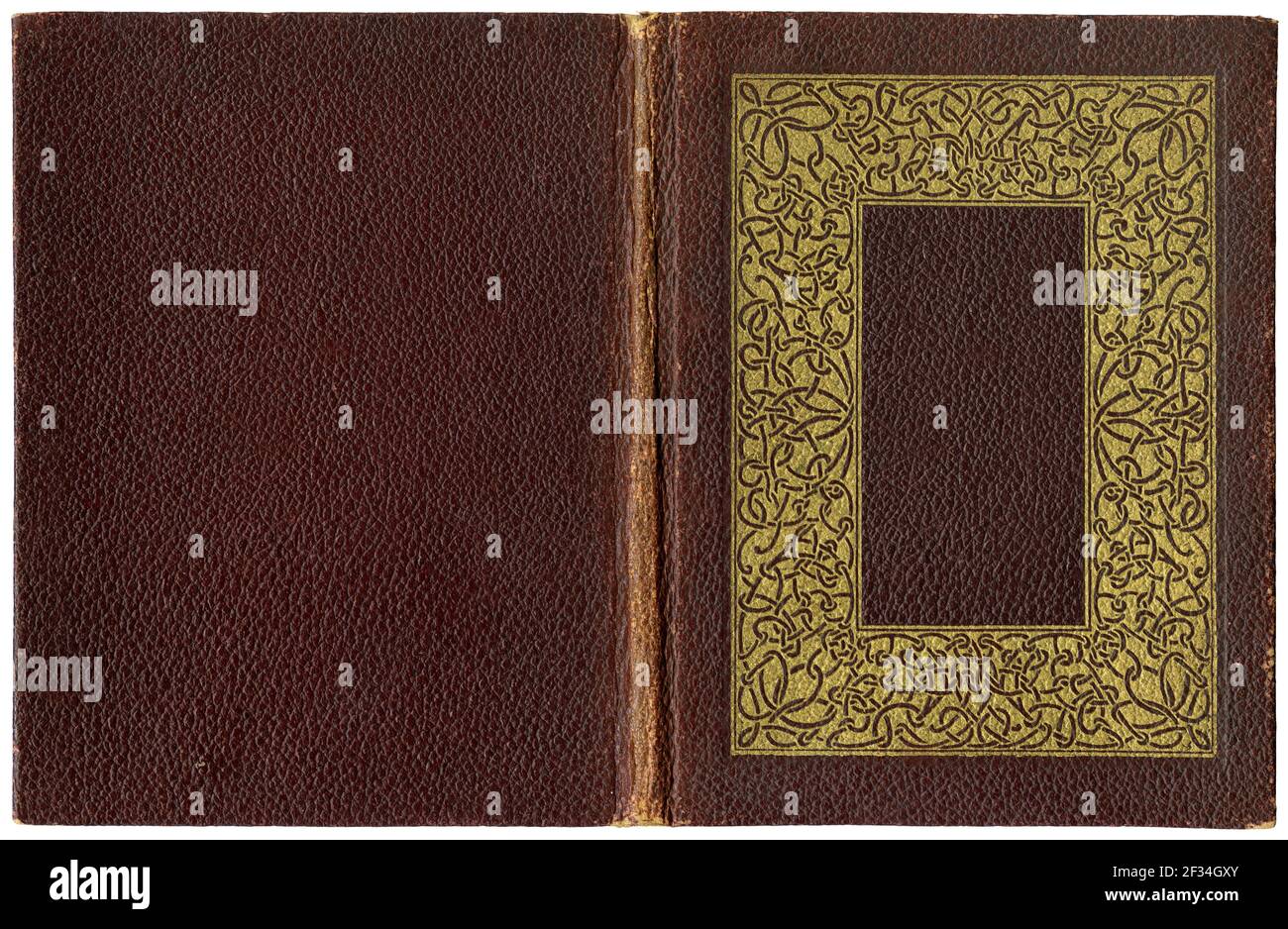 Vecchio libro aperto in tela marrone testurizzata copertina con significativo telaio golden celtic knots - circa 1920 Foto Stock