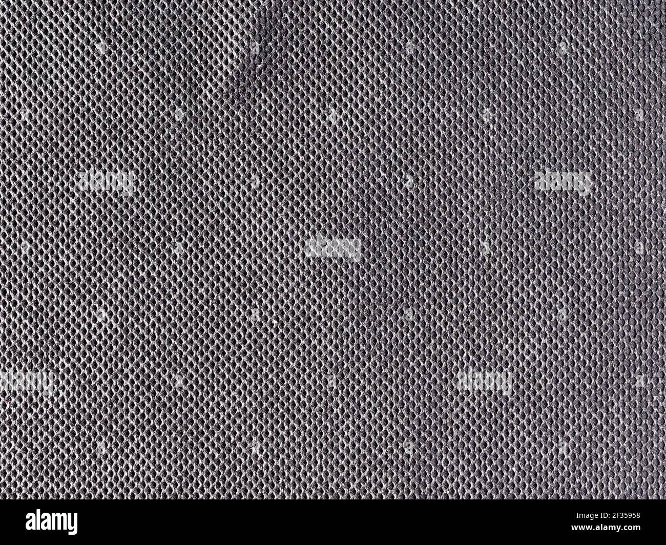 struttura nera astratta con piccoli fori, spruzzi scuri Foto Stock
