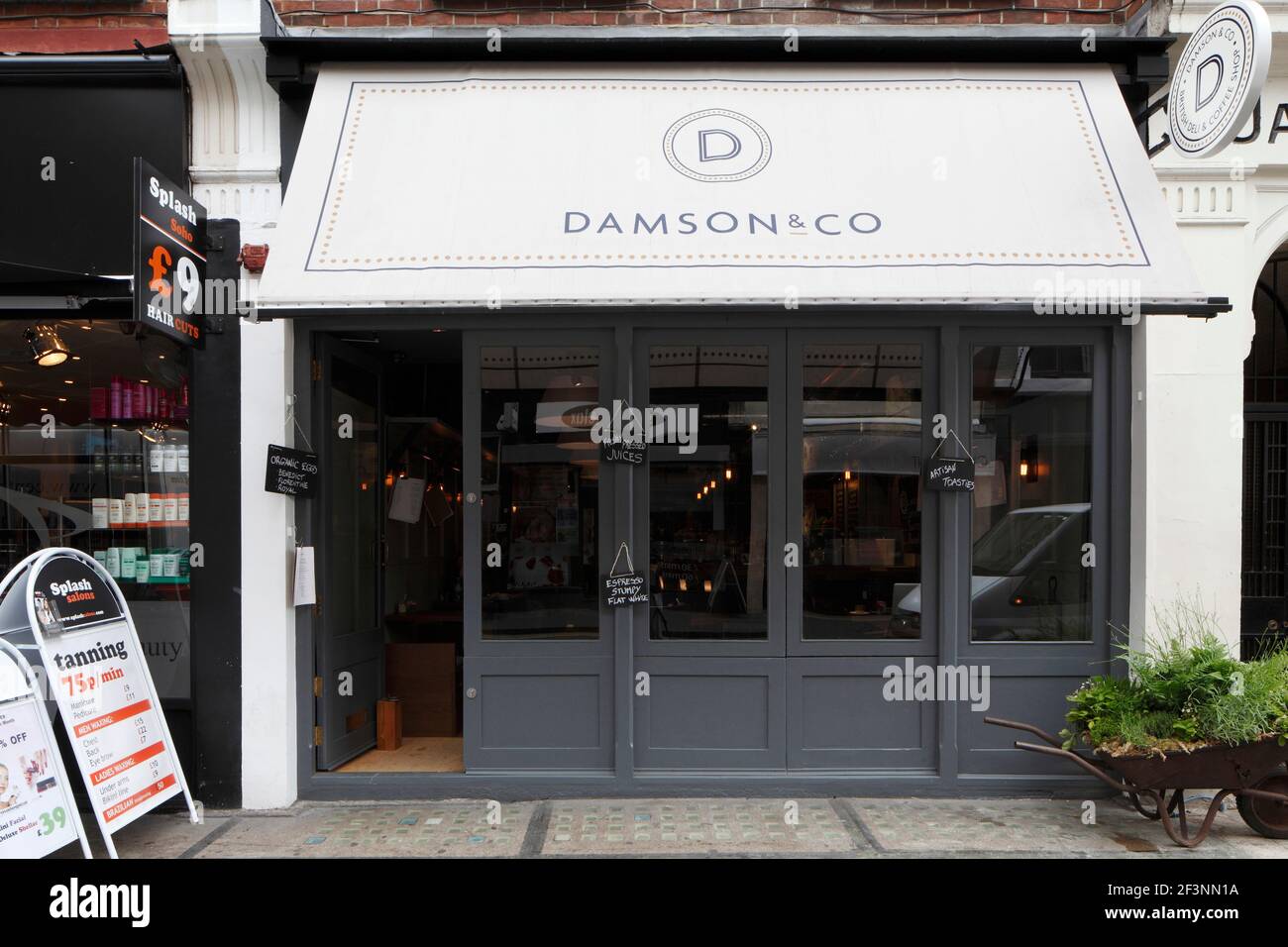 Grey painted shopfront with awning | | Designer: Central Design Studio Foto Stock