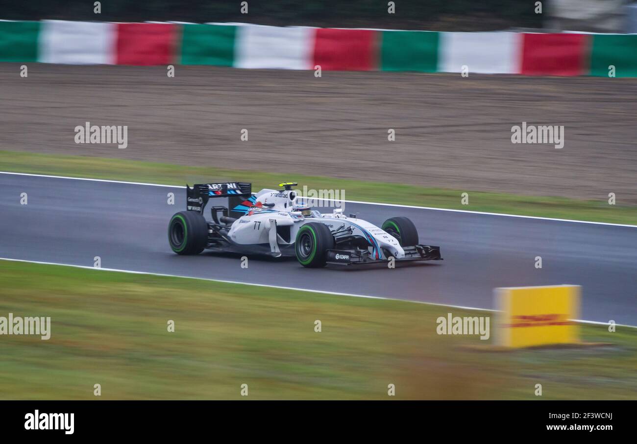 Valtteri Bottas alla guida di una Williams FW36 all’ingresso della Spoon Curve sul circuito di Suzuka durante la pioggia ha colpito il Gran Premio del Giappone 2014. Foto Stock