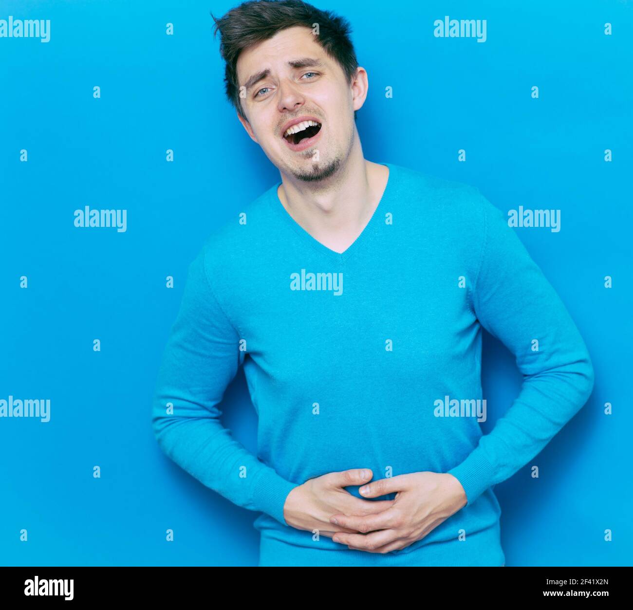 Dolore allo stomaco negli uomini Foto Stock