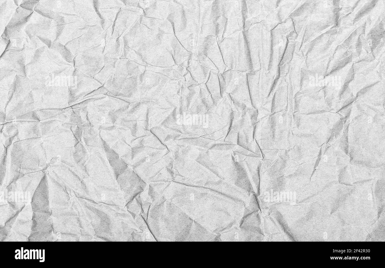 Trama carta artigianale sgualcita. Sfondo grigio astratto Foto Stock