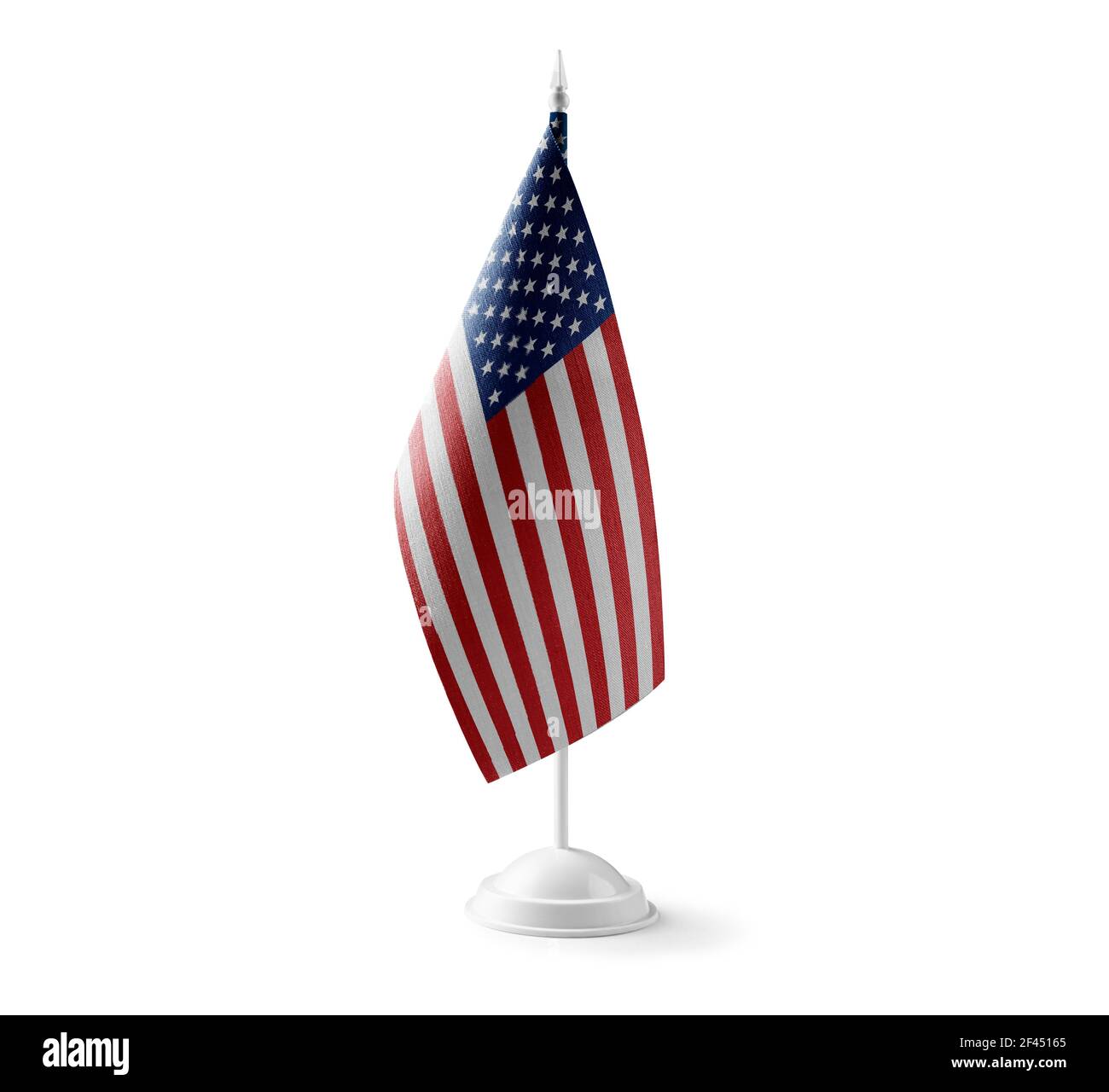 Piccola bandiera nazionale degli Stati Uniti su un bianco sfondo Foto Stock