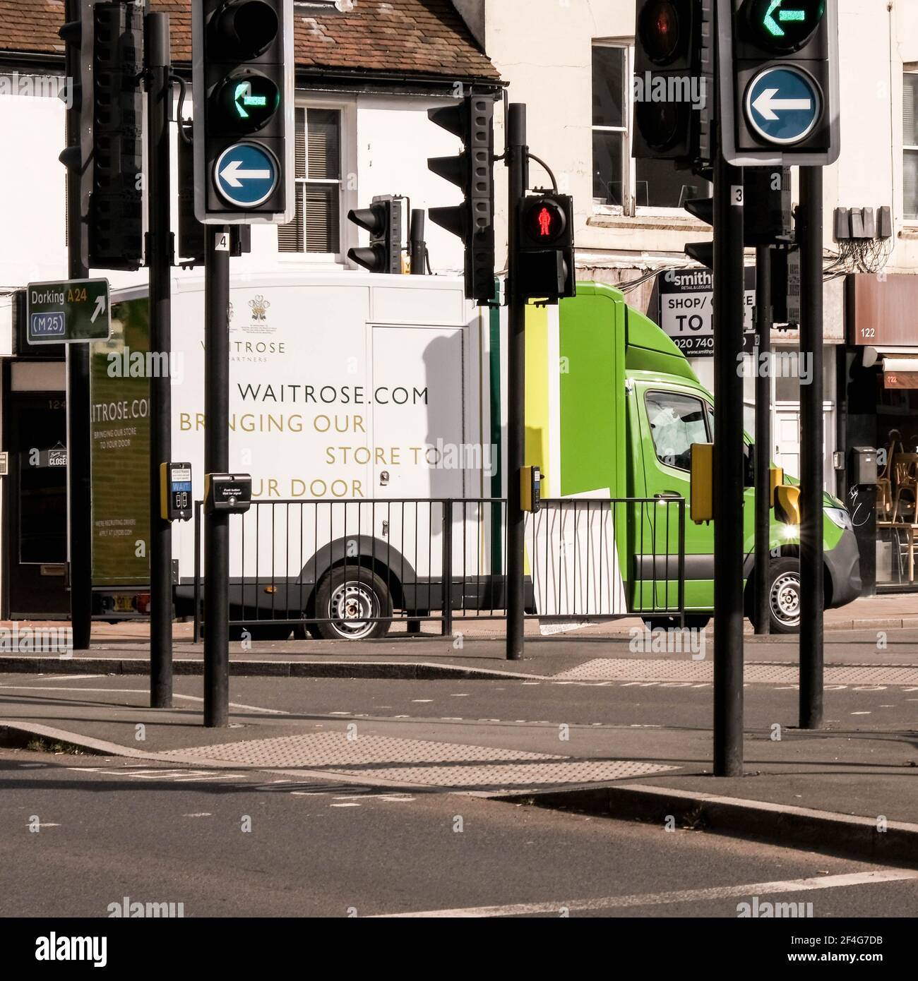 Epsom London UK, March21 2021, John Lewis Waitrose Home Delivery Van al semaforo Foto Stock